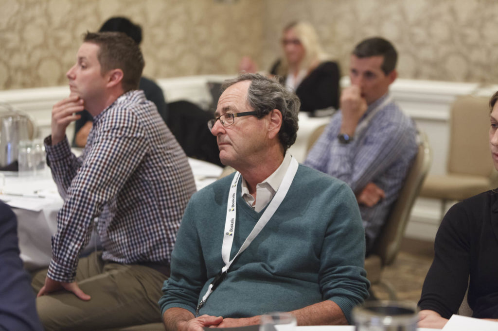 audience members listen to presentations