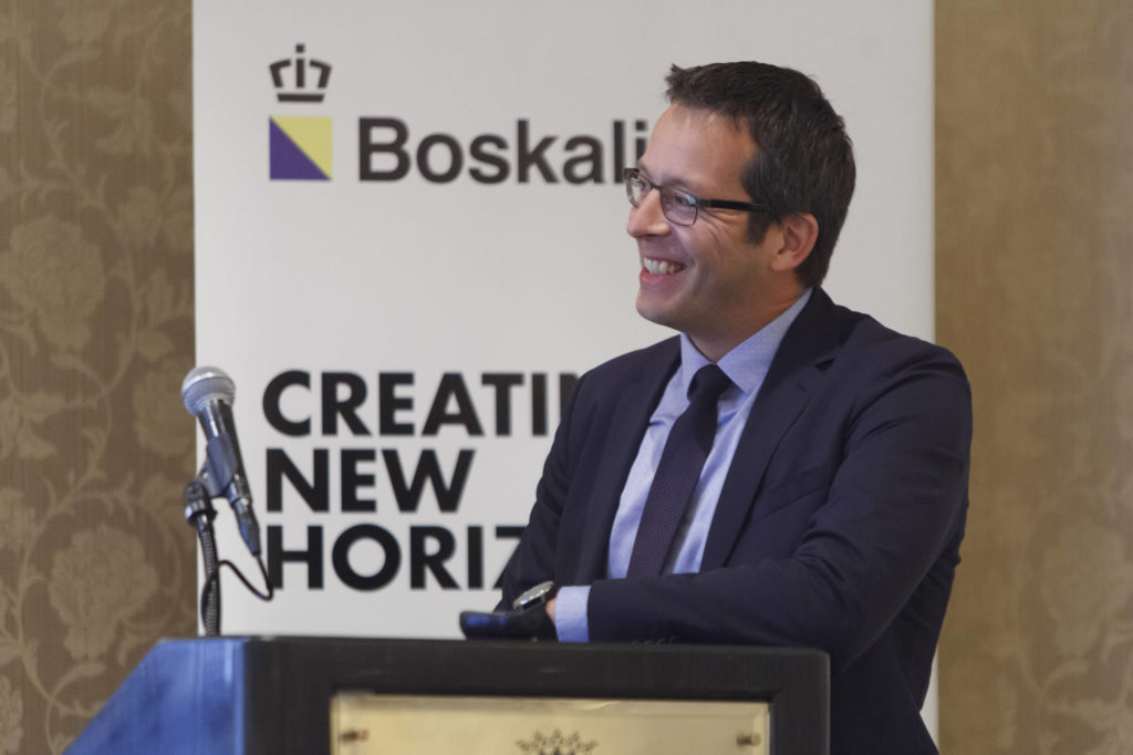 MC smiles at the podium