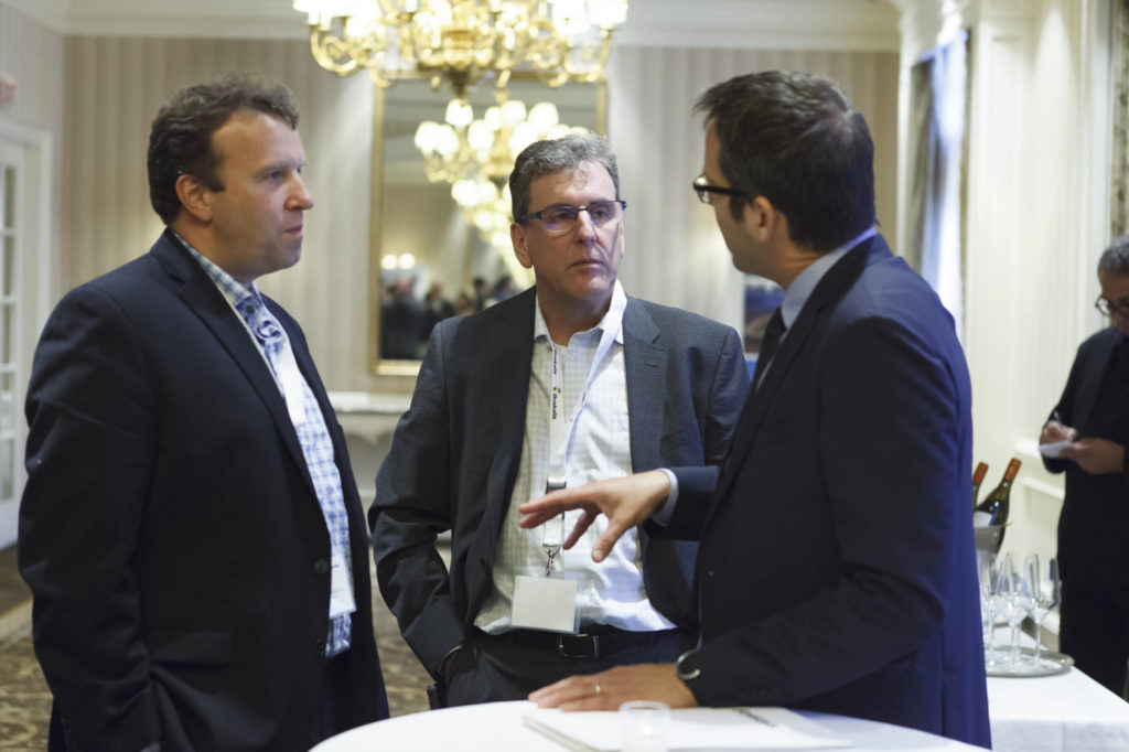 participants speak together during networking break