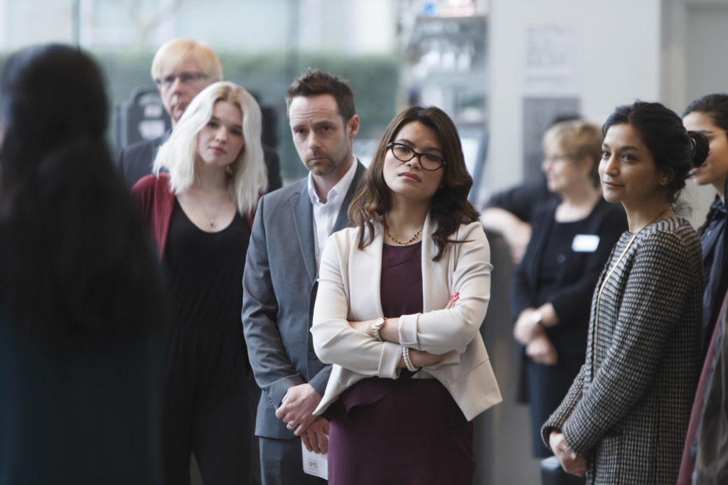 audience members listening to speech