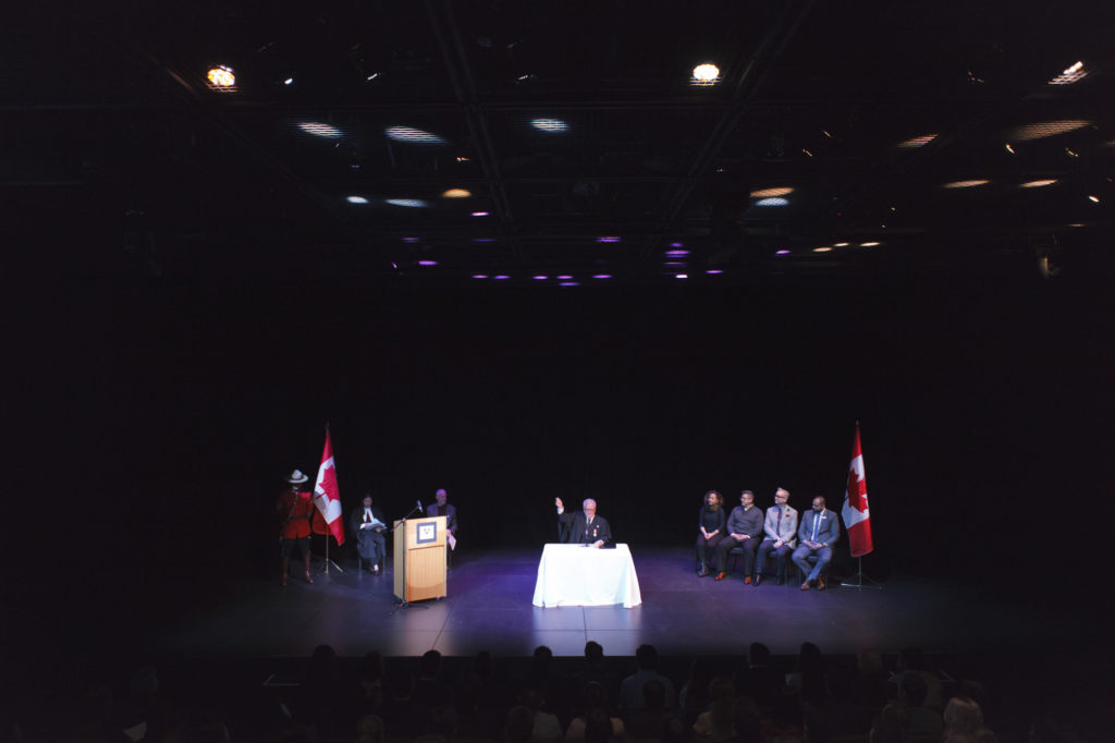 MC explaining oath of citizenship