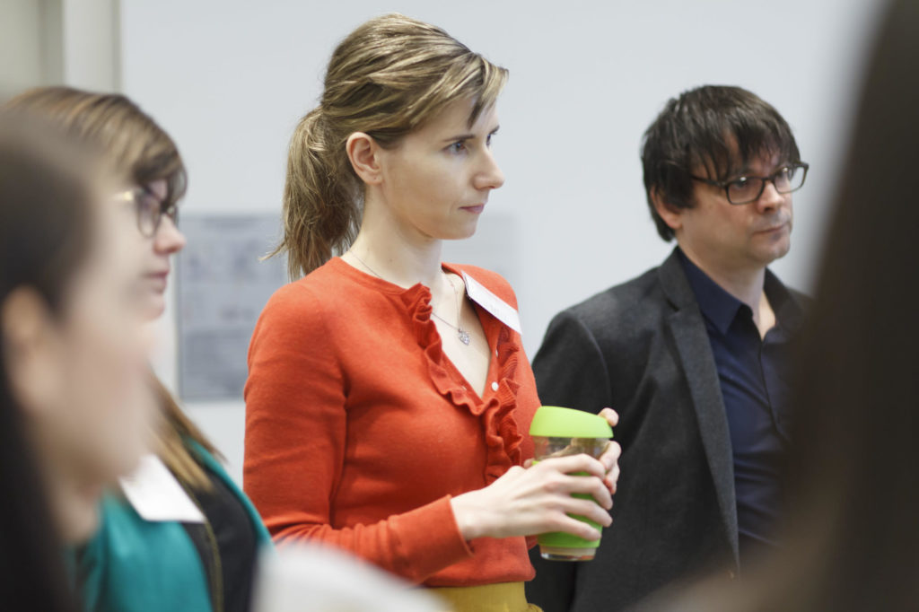 photo of audience members listening