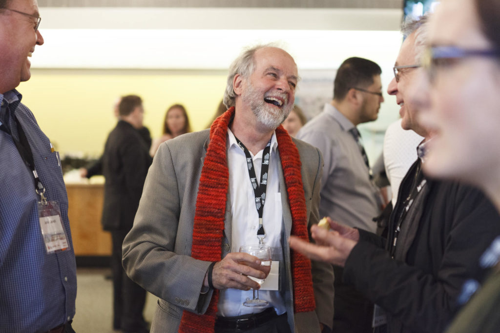 conference participant smiles during networking break