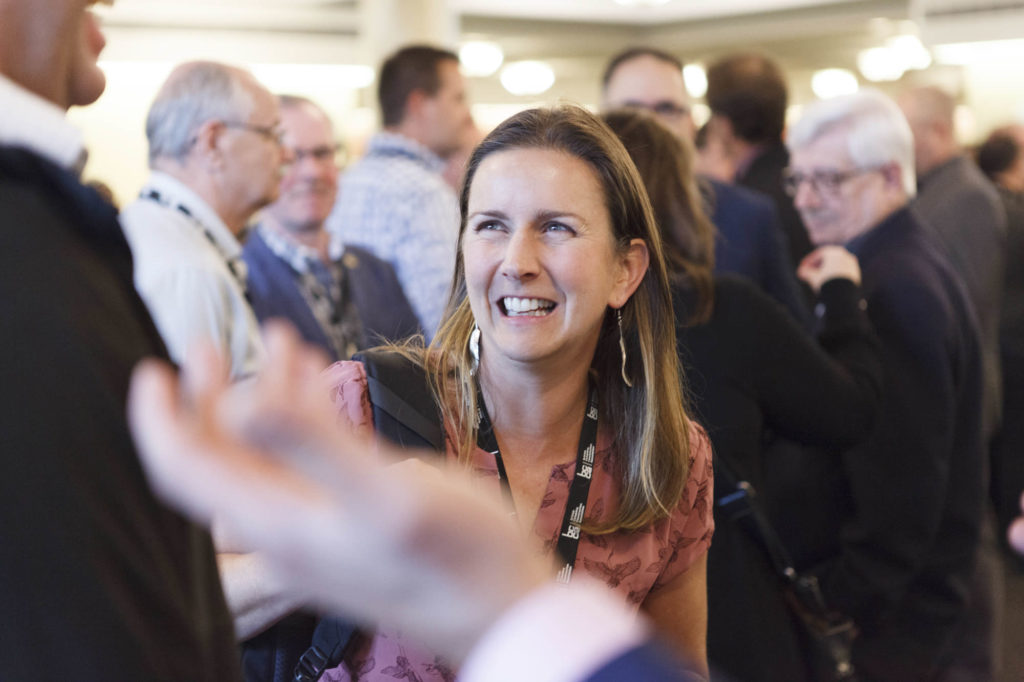 participant smiles while netowrking
