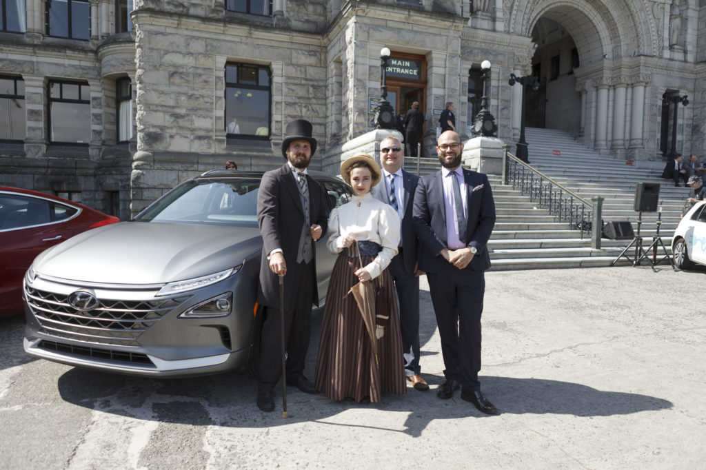 posing for hydrogen car photos at the victoria legislature