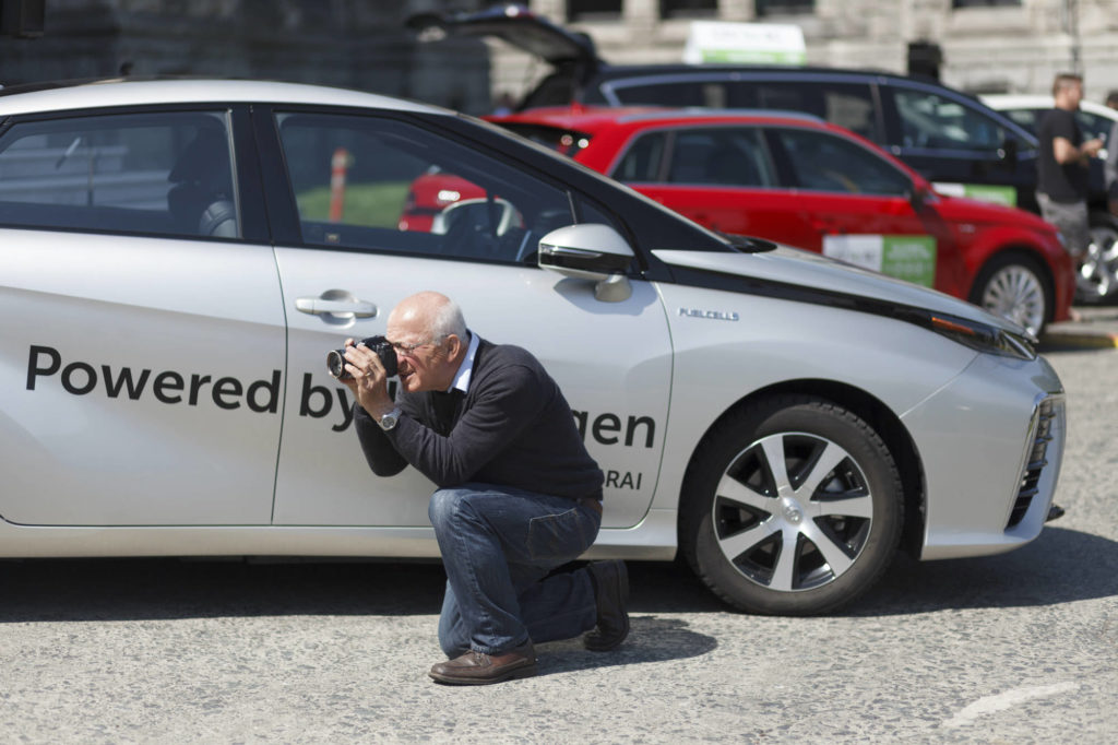 taking photos at the hydrogen cars event in victoria