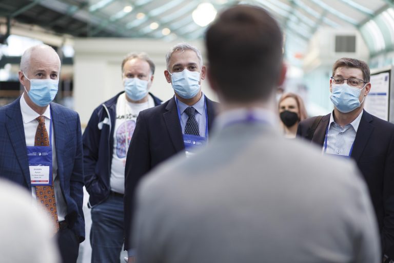event photography of moderation poster session judges
