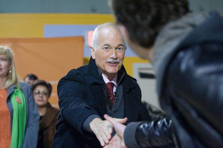 Jack Layton shakes hands with a voter during the canadian federal election