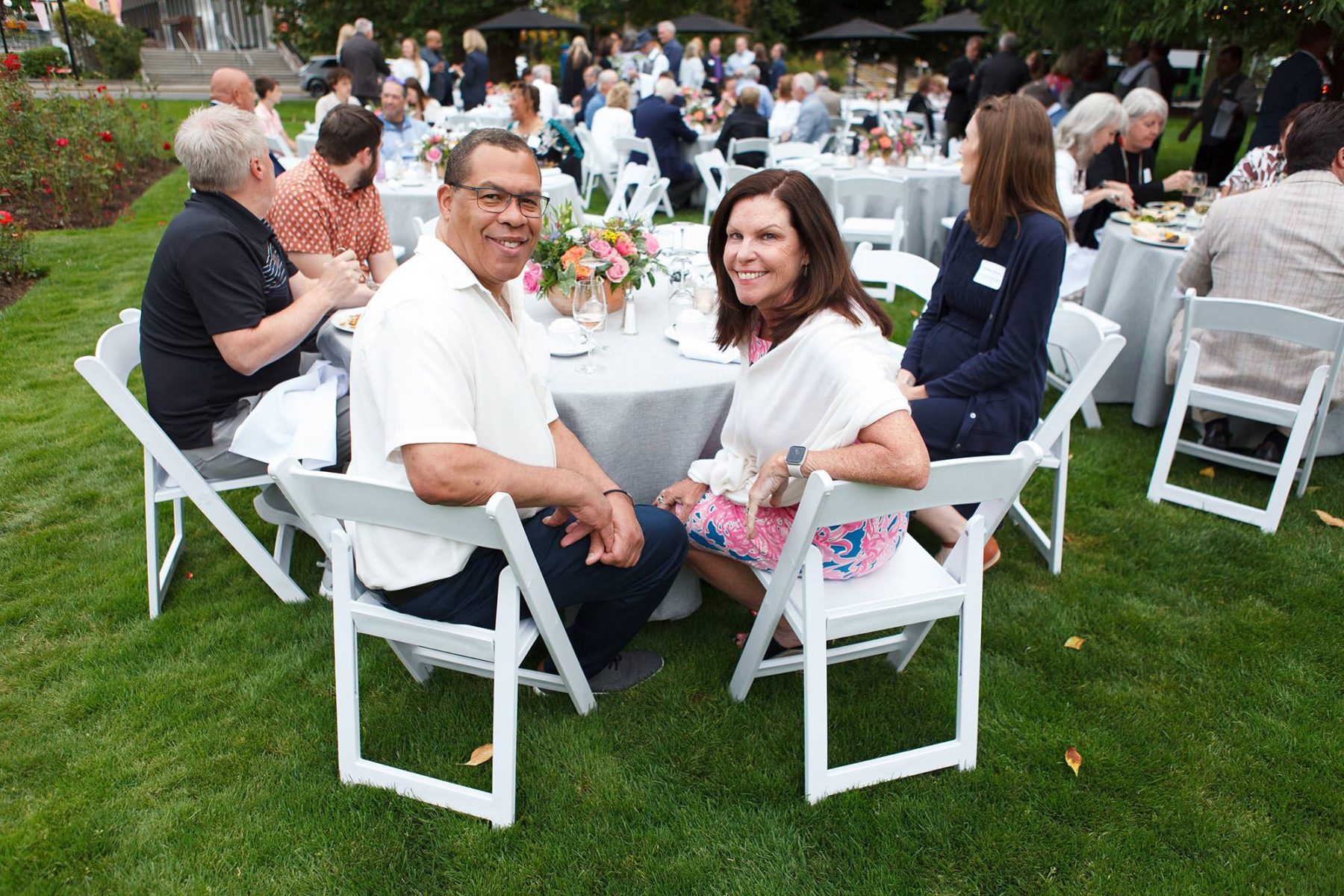 a man and woman smile during a corporate event at victoria conference centre