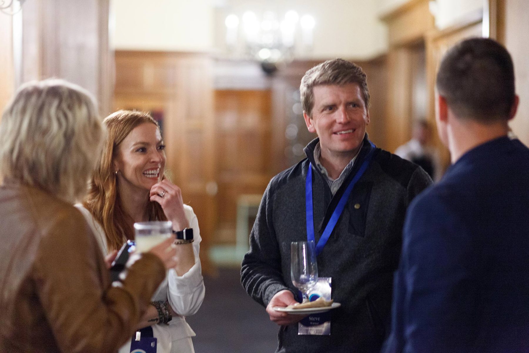 corporate photography of networking moments at a Royal Rhodes university fuctcion