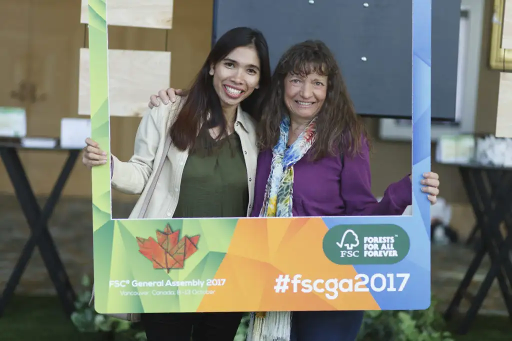 conference participants hold a sign for social media during the FSC convention in Vancouver