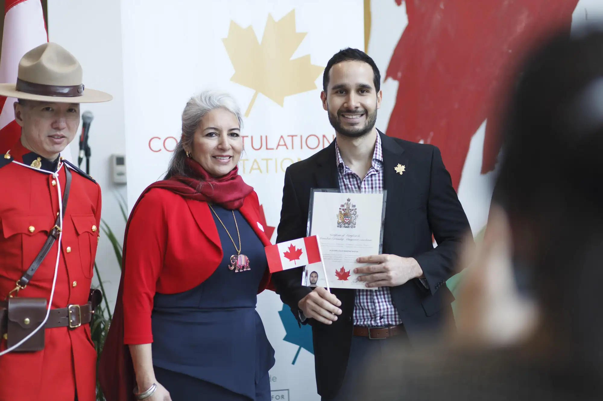 photo of a man receiving his canadian citizenship