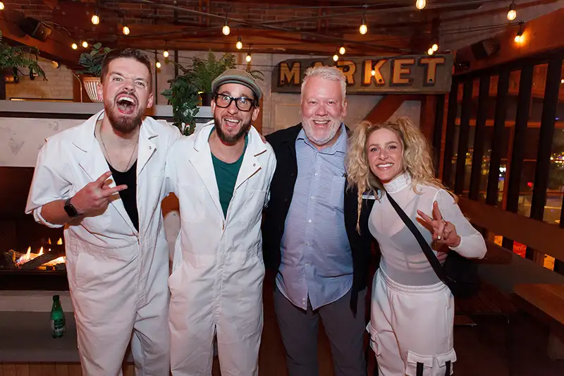 Event photography: members of the band Metric posing backstage with a conference participant at the Ford Elite event in Victoria BC