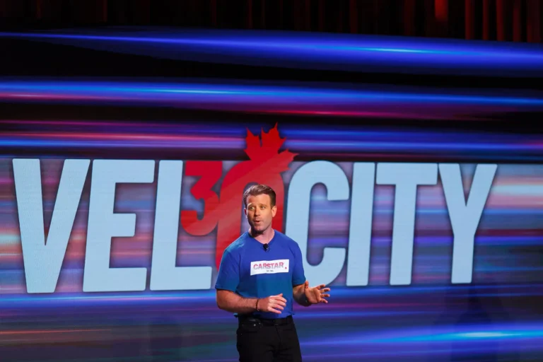 Keynote speaker engaging the audience at the CARSTAR Velocity conference at the Victoria Conference Centre