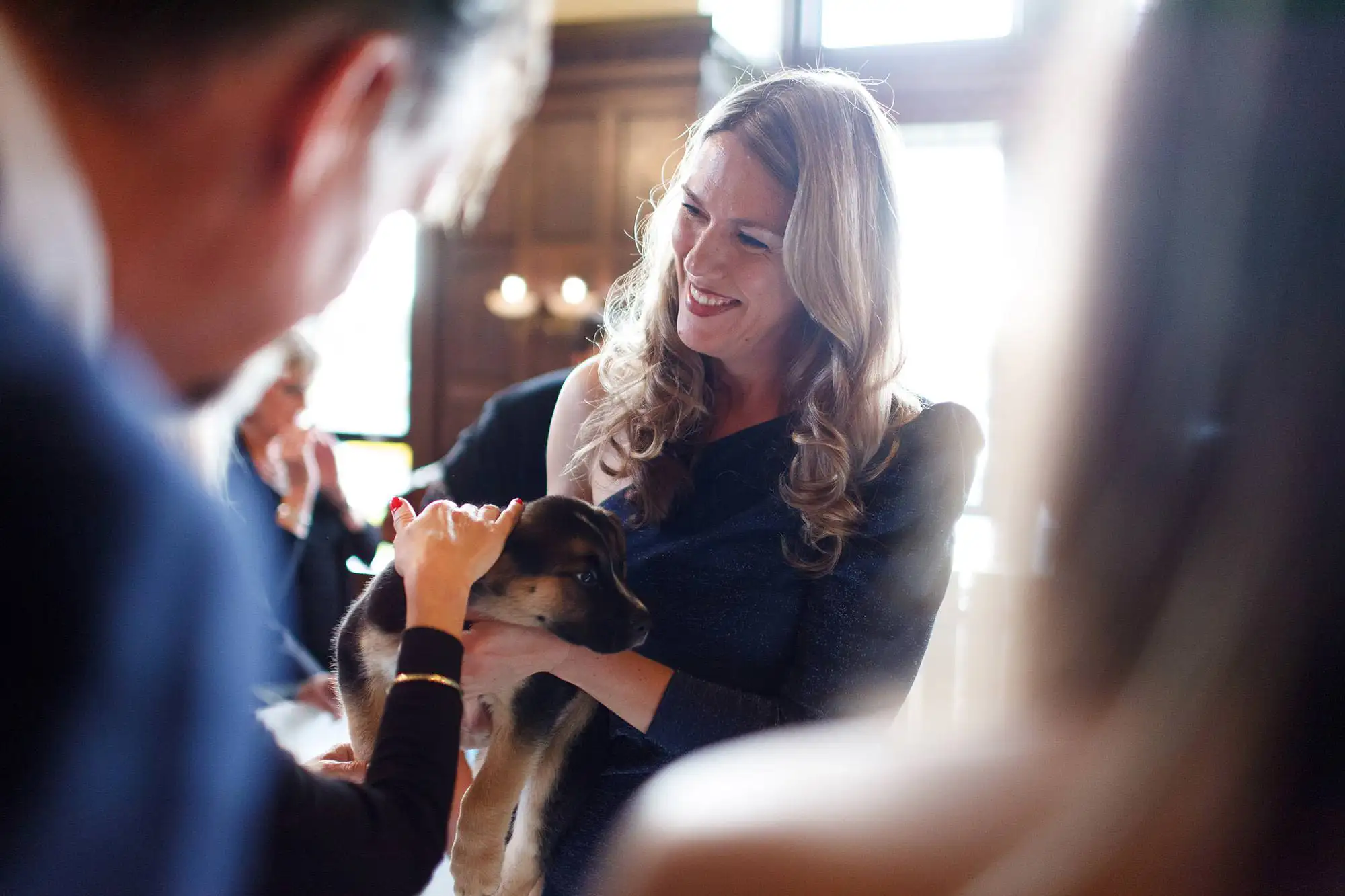 photo of a woman holding a puppy during an spca charity event in Victoria