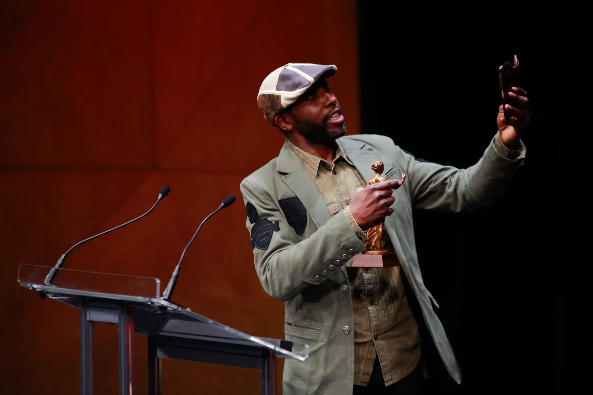 an actor takes a selfie with his award at the UBCP ceremony in Vancouver