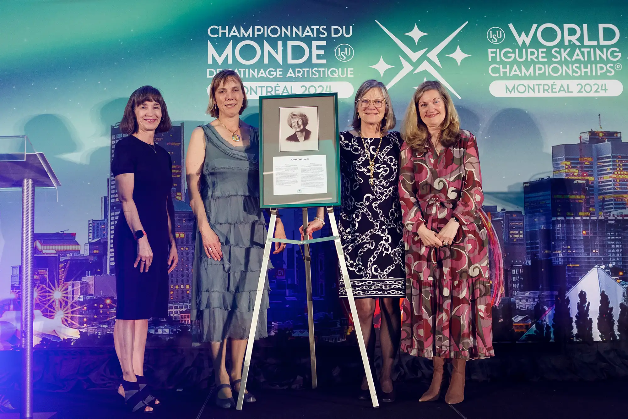 a group of women stand on the stage during a lifetime achievement award ceremony in Vancouver