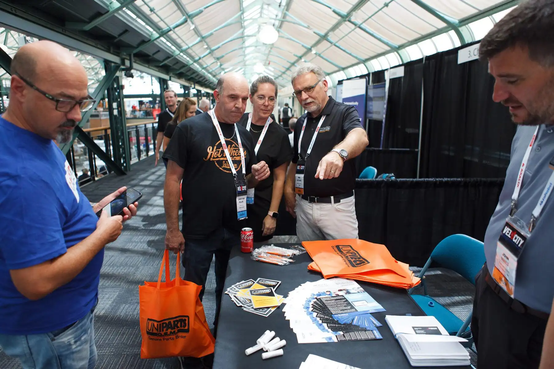 conference goers at crystal gardens in Victoria gather at a trade show booth