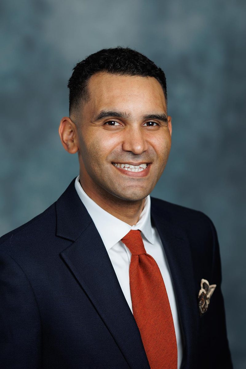 Executive portrait in Victoria BC of a man in suit with a muslin backdrop