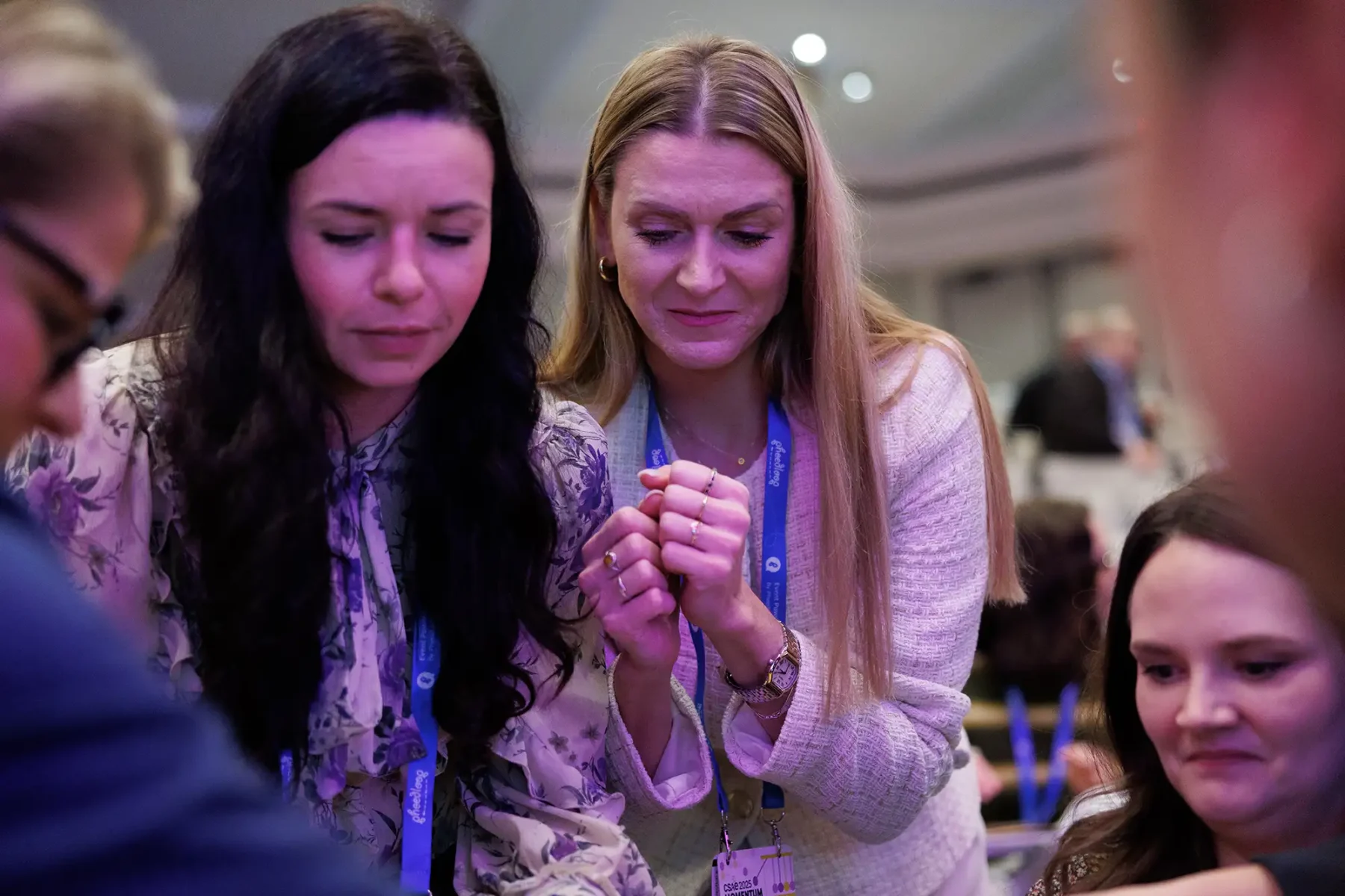 conference attendees smile during an activity at the CSAE conference in Victoria BC