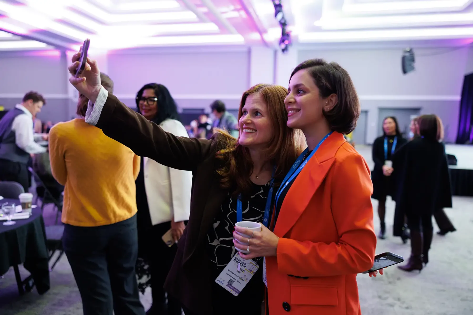 candid photography of conference participants taking a selfie together at the Victoria Conference Centre
