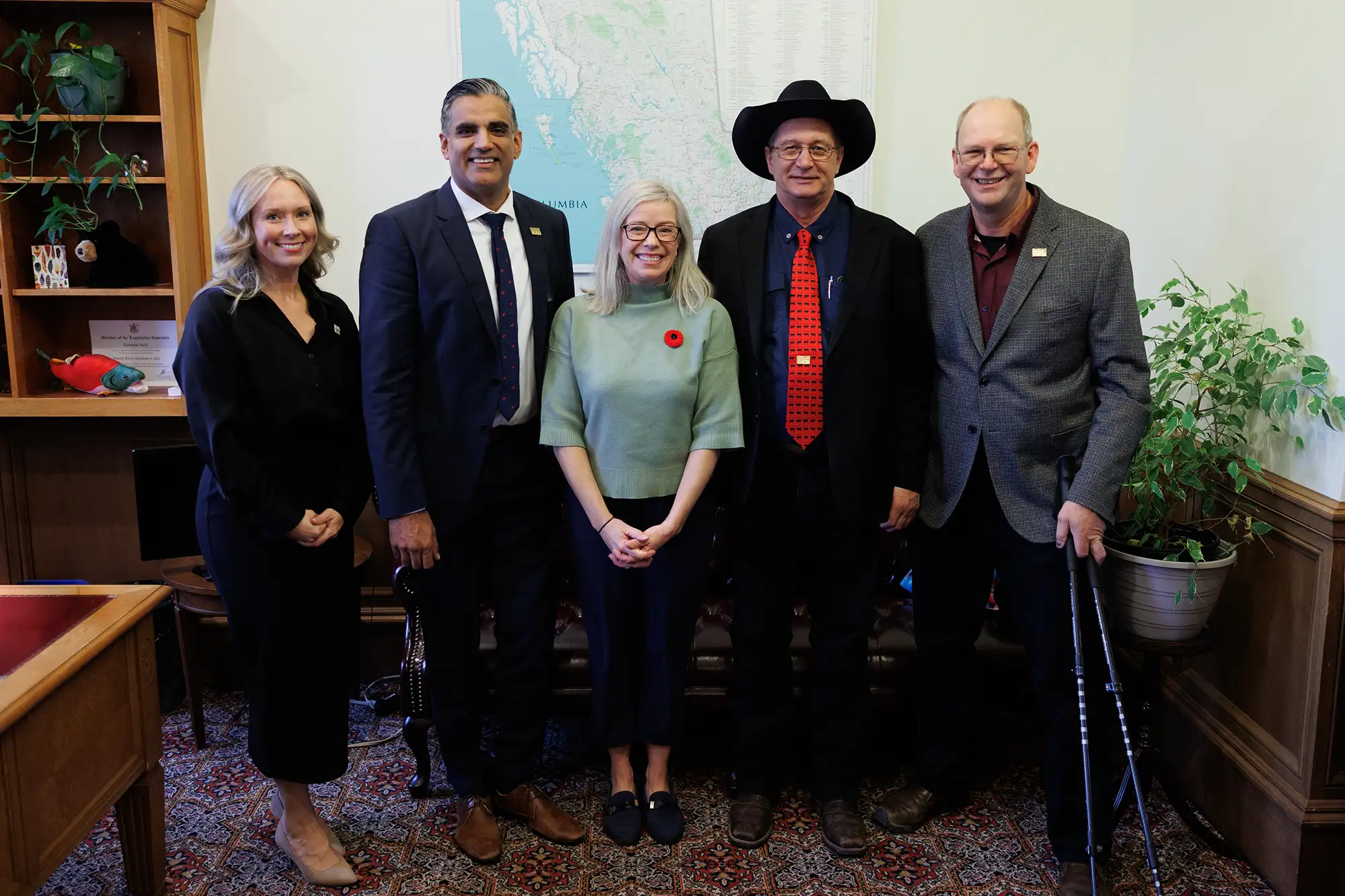 An advocacy group poses with a BC MLA during a lobbying event at B.C. Legislature, example of public affairs photography