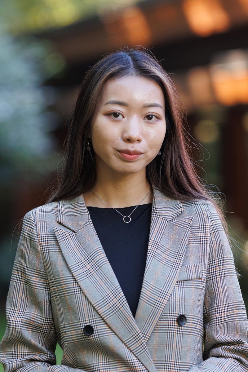 corporate headshots in Victoria BC of a woman with blazer in outdoor setting