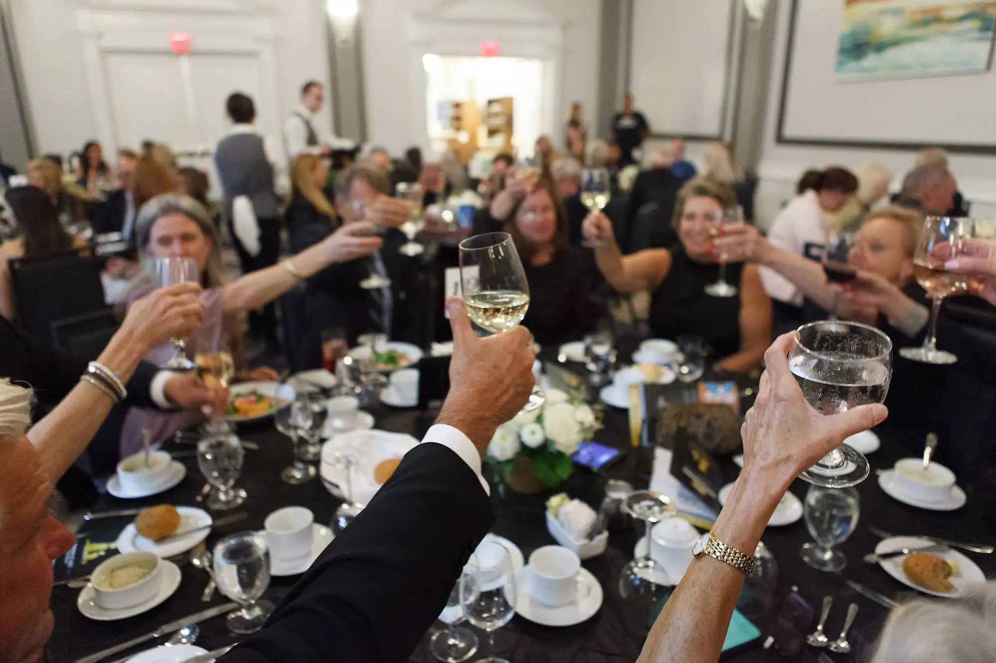 photography of a toast during a non-profit gala fundraising dinner at the fairmont hotel in Victoria BC