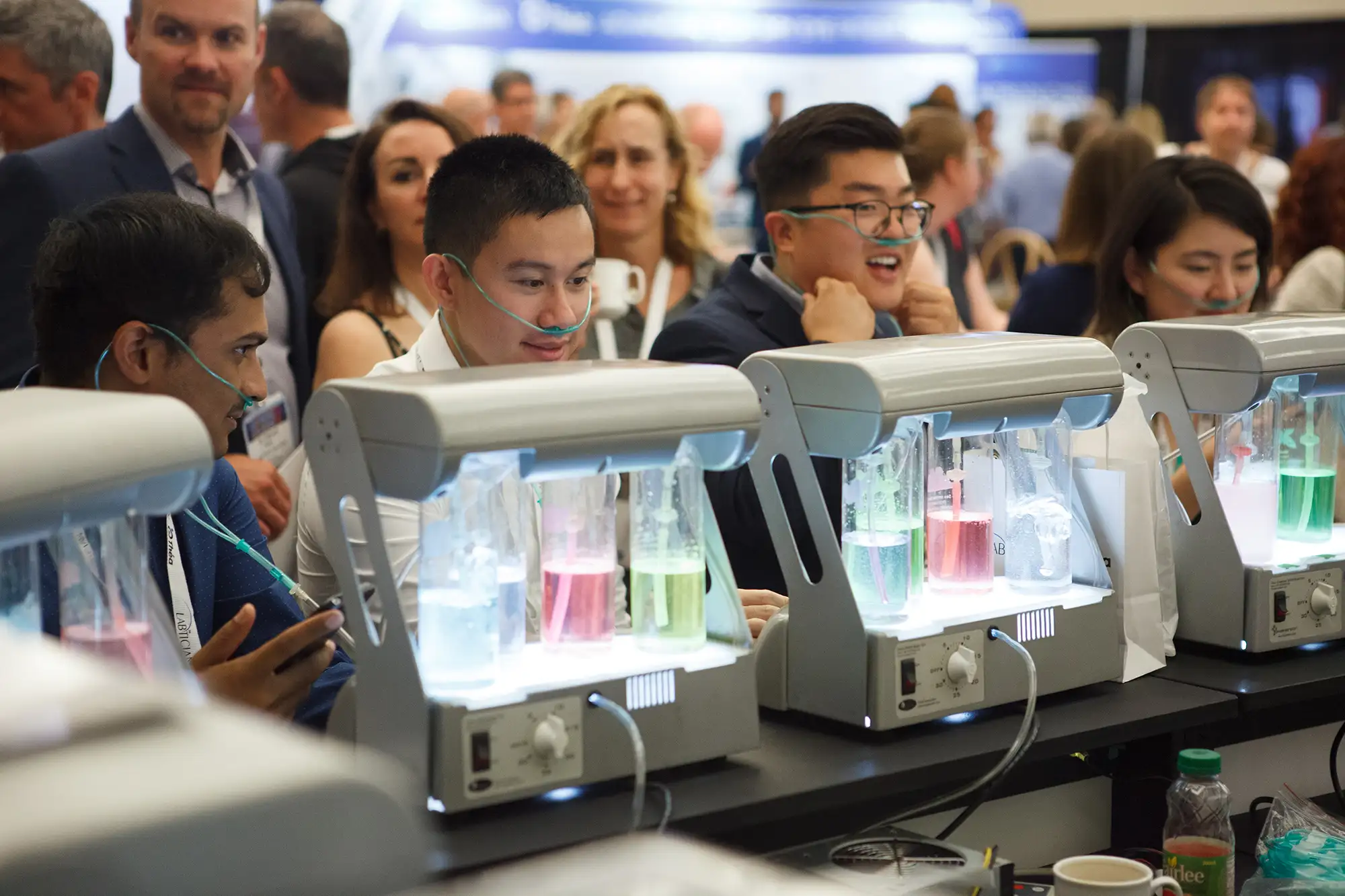 conference attendees try new technology at a sponsor brand activation at the Victoria conference centre