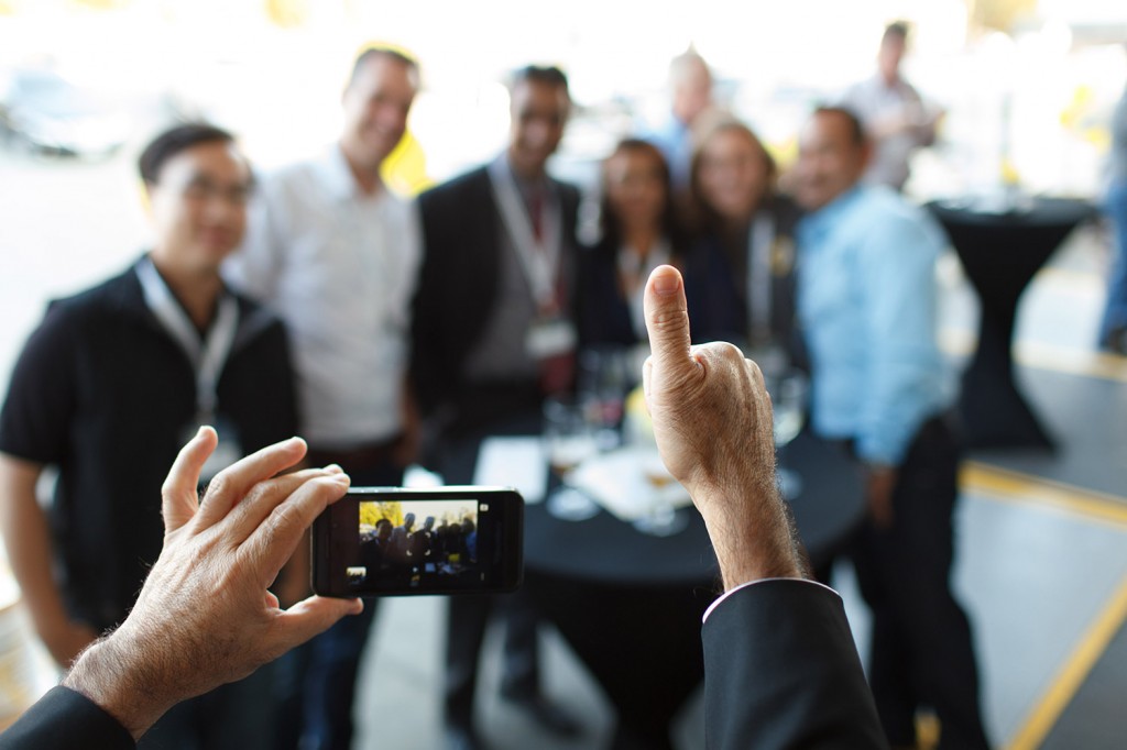 groupshot with a smartphone at the kryton anniversary in vancouver