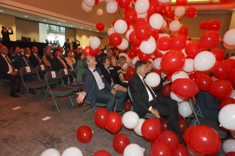 Balloons fall on event attendees at the Victoria Conference Centre